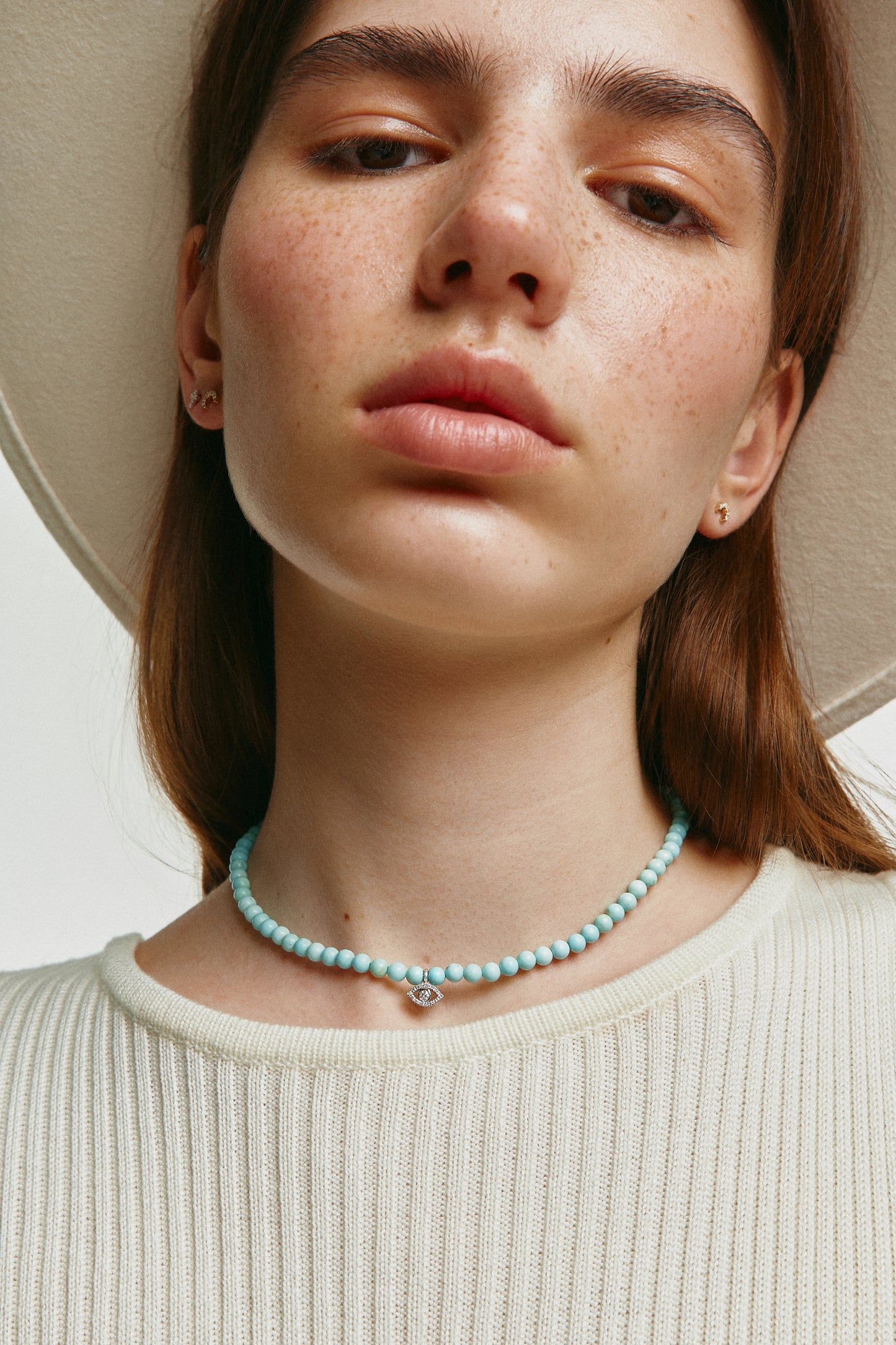 howlite choker with big white gold diamond evil eye