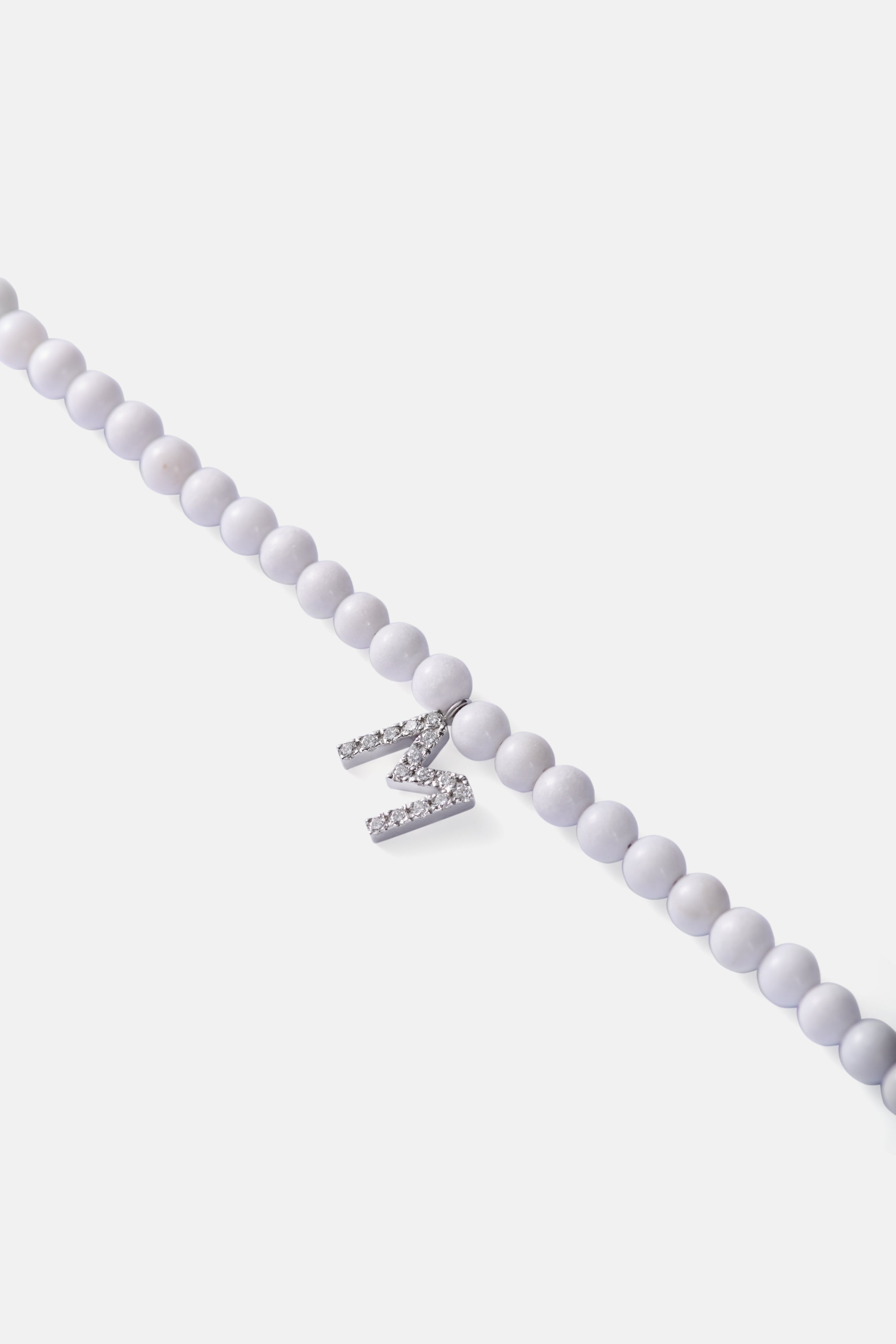 tridacna choker with white gold diamond letter
