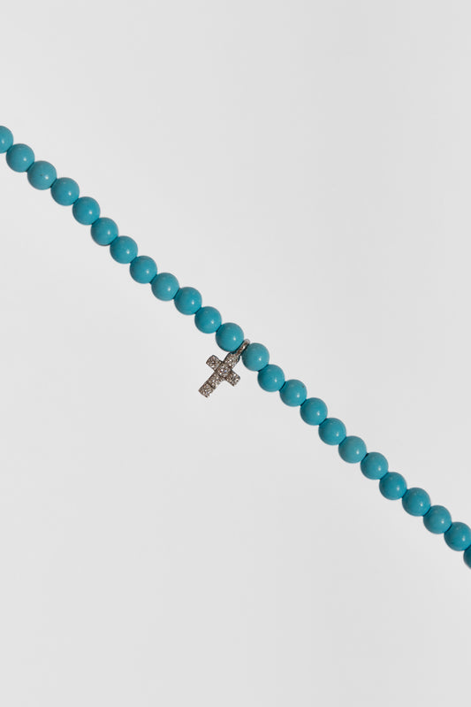 turquoise choker with big white gold diamond cross