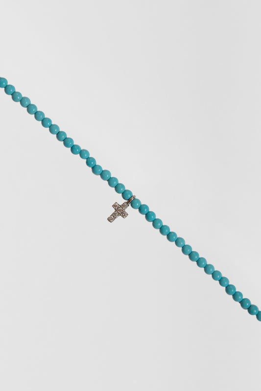 turquoise choker with small white gold diamond cross