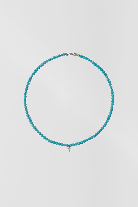 turquoise choker with small white gold diamond cross